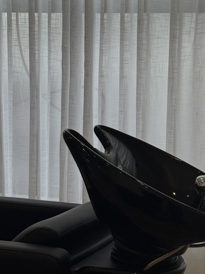 Basin by sheer curtains in the studio