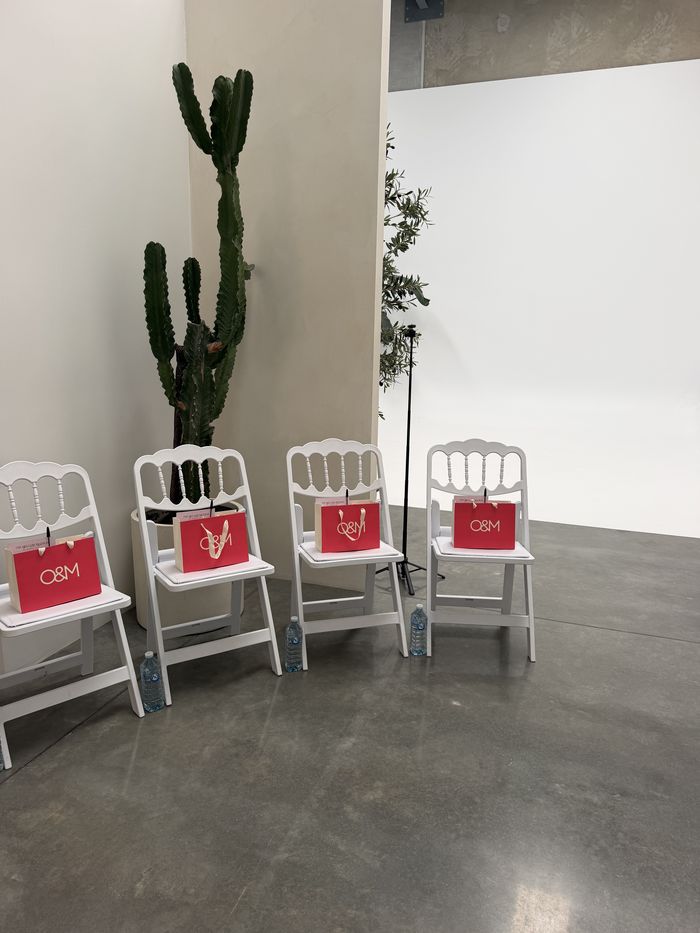 Guest chairs set with O&M gift bags before the masterclass